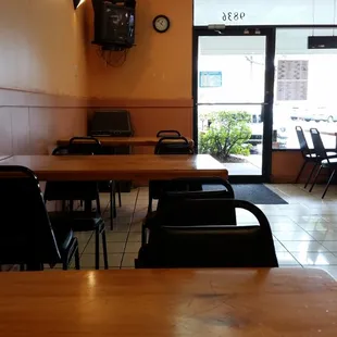 empty tables and chairs in a restaurant