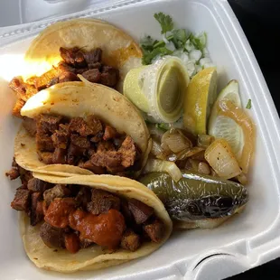 Spicy Tropo Pork Tacos with corn tortillas.