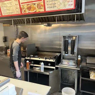 a man preparing food in a restaurant kitchen