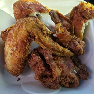 Fried chicken, i took four big bites inside the parking lot..