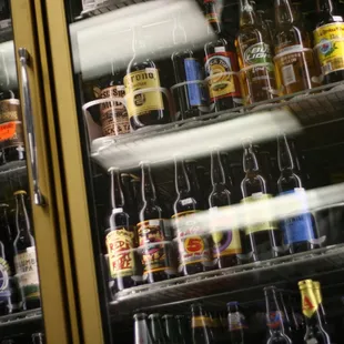 a variety of bottles in a refrigerator