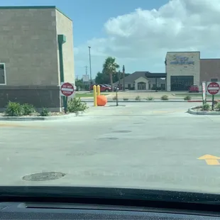 Confusing spot. Arrows point straight ahead, signs indicate do not enter...