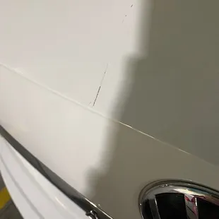 New car, deep scratch.