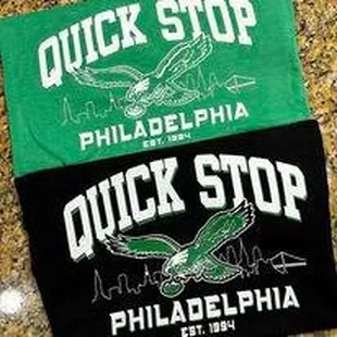 two t - shirts on a granite countertop