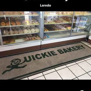 Bakery showcase filled with a good selection of Pan Dulce &amp; cookies.
