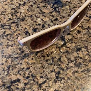 Broken sunglasses, missing one arm