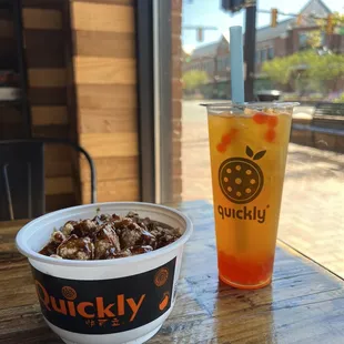Mango green tea boba and a teriyaki chicken rice bowl.