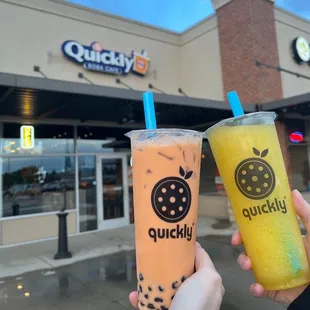 two drinks in front of a building