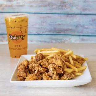 a plate of fried chicken and french fries