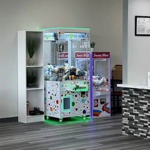 Opposite of the tables are crane game machines