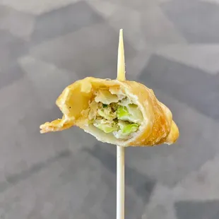 a piece of food on a toothpick