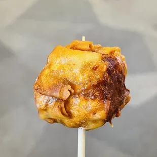 a close up of a pastry on a stick