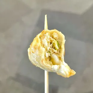 a close up of a food item on a stick