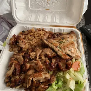 chicken and rice in a styrofoam container