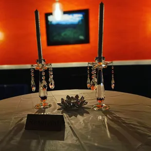 two crystal candles on a table