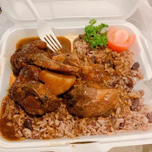 Brown stew chicken w/ extra rice and peas