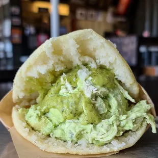 a close up of a sandwich with guacamole