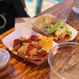 Chorizo nachos and seafood taquito