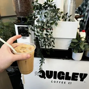a person holding a cup of coffee