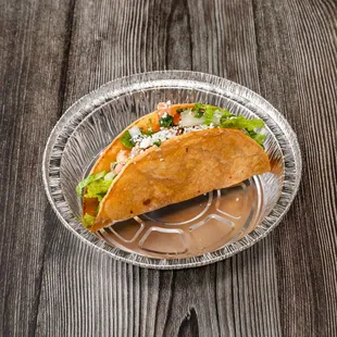 a taco in a plastic container