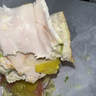 Small portion of turkey provided on sandwich.