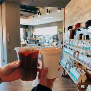 a person holding a cup of coffee