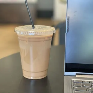 Iced mocha, light ice, oat milk.