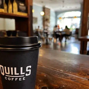 a coffee cup on a wooden table