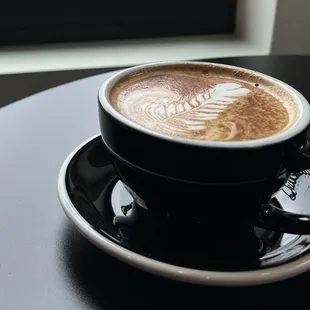 a cup of coffee on a saucer