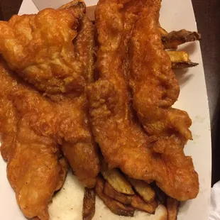 Catch of the day - Catfish with bread, fries, and onion