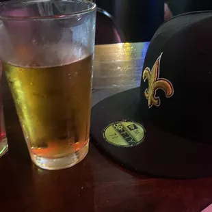 two glasses of beer and a cap