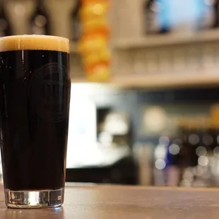 a pint of dark beer