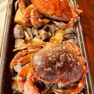 Whole crab and clam in garlic butter cajun sauce