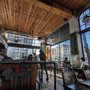 Rustic wood interior with huge windows.