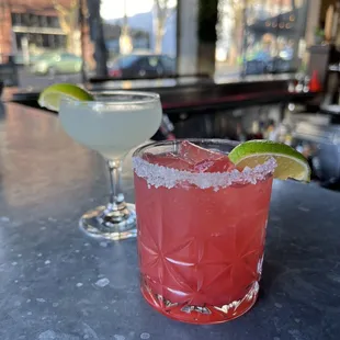 two cocktails on a bar