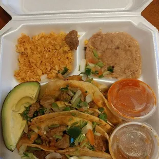 a meal in a styrofoam container