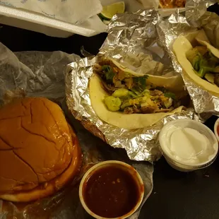BBQ pork sandwich and 2 pork tacos. Sides of spicy Chipotle BBQ, sour cream, and salsa.