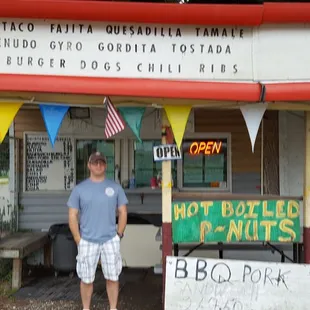 a man standing in front of a booth