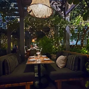 The outdoor seating is among lush foliage, antique lamps, sky views, stone floors...very romantic on the evening.