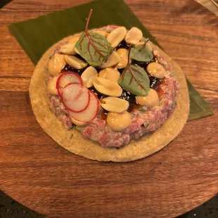 a closeup of a quiche on a wooden board