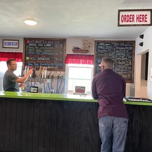 a man standing at the counter