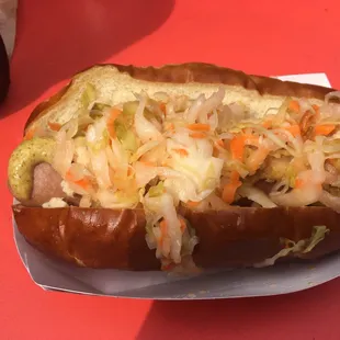 a hot dog with sauerkraut and carrots