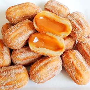 Churros Caramel...Are delicious deep fried dough sticks, traditionally sprinkled powdered sugar and filled with caramel.