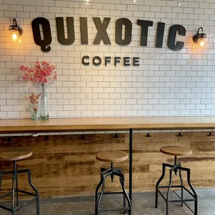 two stools in front of a counter