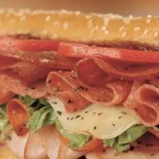 a sub sandwich with meat and cheese