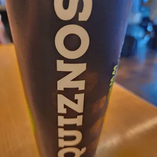 a cup of soda on a table