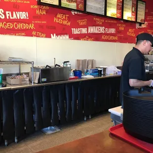 a man working in a fast food restaurant