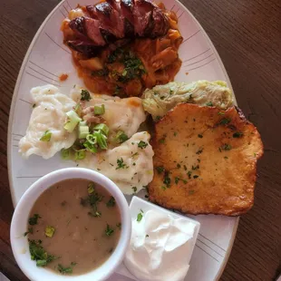 Polish sampler: polish sausage,  sautéed cabbage &amp; tomatoes,  pierogies, cabbage roll, potato pancakes, &amp; mushroom sauce.