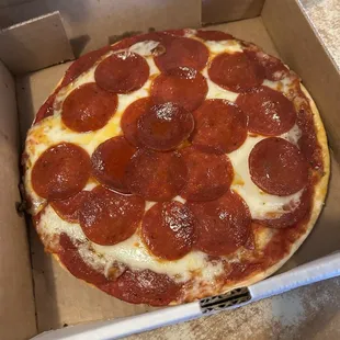 Par baked pepperoni on top of cheese