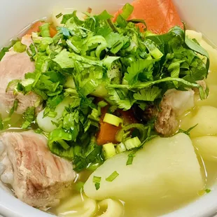 Macaroni soup with pork ribs, carrots and potatoes (sup nui)
